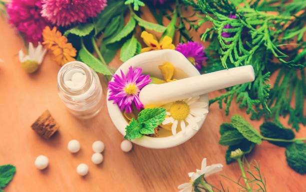 istock Homeopathy in small jars. Herbal extract. Selective focus. 1276662406
