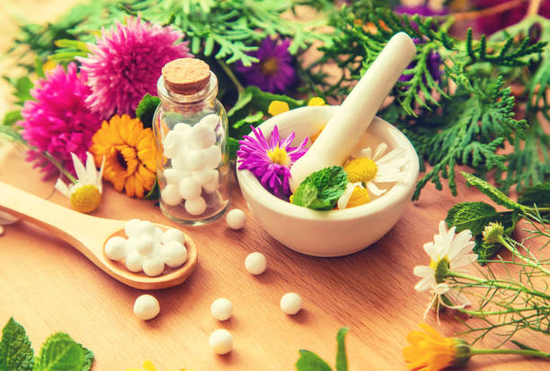 istock Homeopathy in small jars. Herbal extract. Selective focus. 1276662414