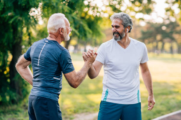 istock Smiling athletes jogging in the park. 1276662763