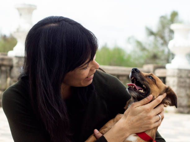 istock woman with her dog 1276663491