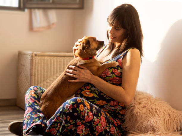 istock woman with her dog 1276663866