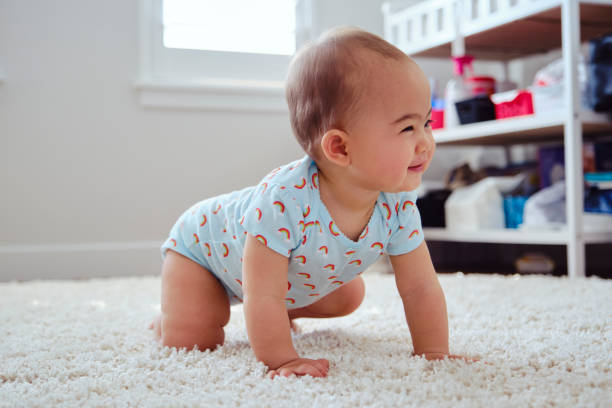 istock Japanese American Baby Learning to Crawl 1276664697