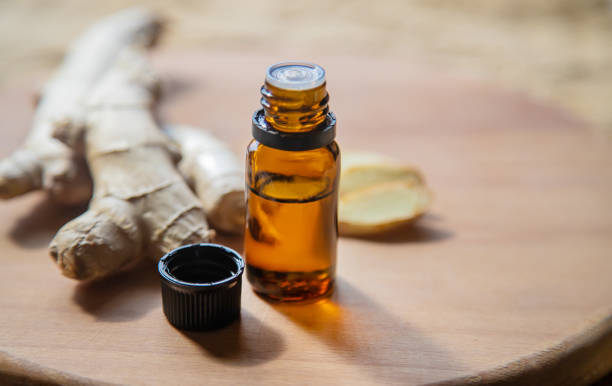 istock Ginger essential oil in a small bottle. Selective focus. 1276667055