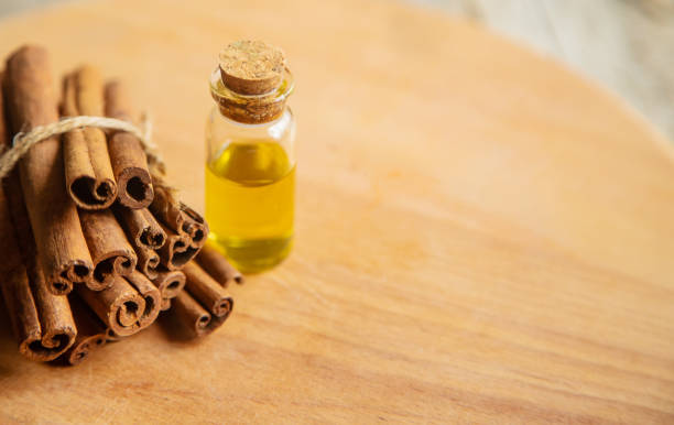 istock Cinnamon essential oil in a small bottle. Selective focus. 1276667088