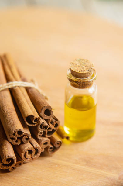 istock Cinnamon essential oil in a small bottle. Selective focus. 1276667089