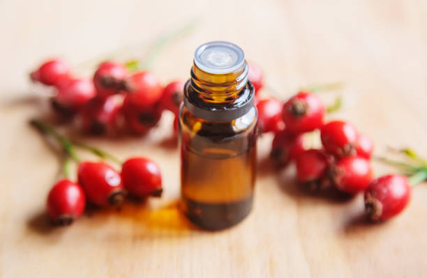 istock Rosehip seed essential oil in a small bottle. Selective focus. 1276667090