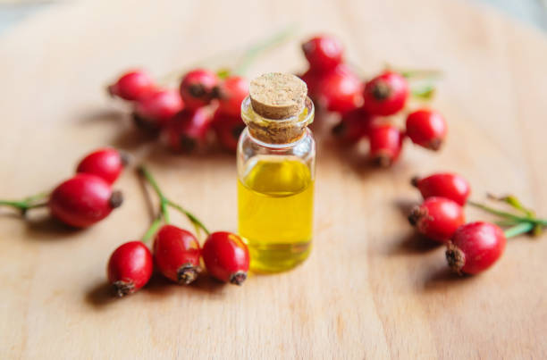 istock Rosehip seed essential oil in a small bottle. Selective focus. 1276667092