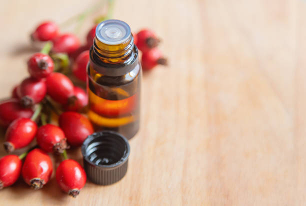 istock Rosehip seed essential oil in a small bottle. Selective focus. 1276667093