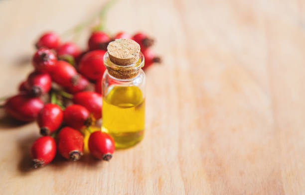 istock Rosehip seed essential oil in a small bottle. Selective focus. 1276667094