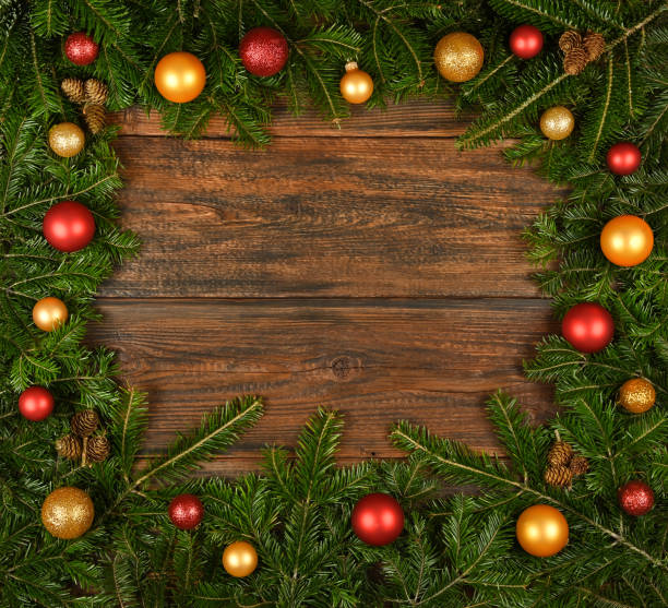 istock Close up fresh Christmas tree frame over wood 1276667505
