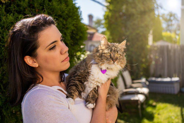 istock Latin woman with her cat in the backyard 1276667699