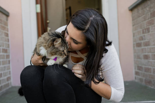istock Latin woman with her cat in the backyard 1276668370