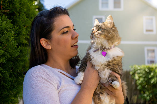 istock Latin woman with her cat in the backyard 1276668376