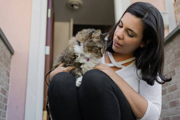 istock Latin woman with her cat in the backyard 1276668382