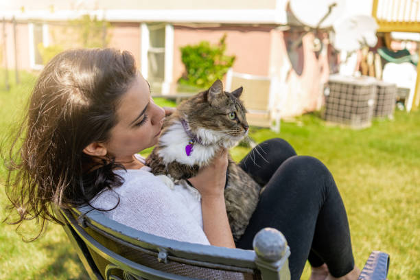 istock Latin woman with her cat in the backyard 1276668410