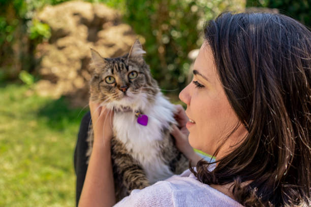 istock Latin woman with her cat in the backyard 1276668459