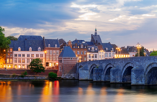 View at the Sint Servaas bridge over the Meuse river( Maas) in the city center of Maastricht, Netherlands, during sunset