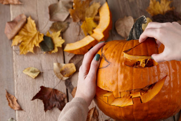 istock Cutting scary pumpkin jack for Halloween 1276669052