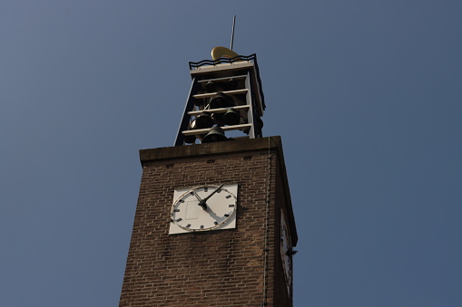 Church tower with carillon and clock  in Nieuwerkerk aan den IJssel