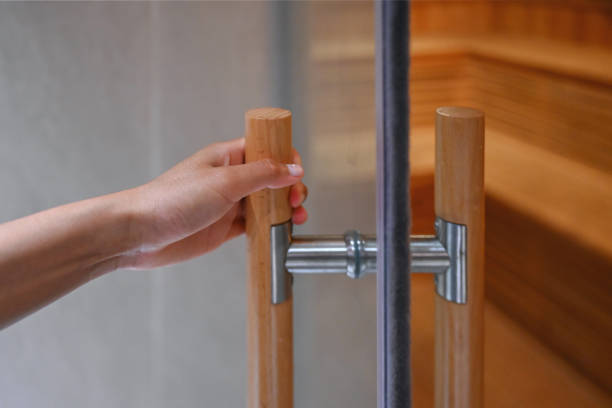 istock Woman opens a sauna door 1276671462