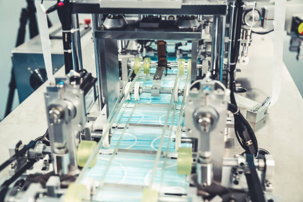 istock Face mask production line in modern factory 1276672602
