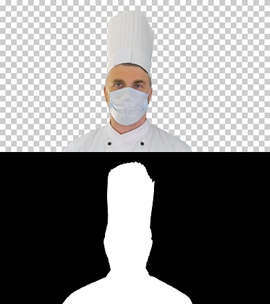 Close up. Male chef cook wearing face protective medical mask for protection from virus disease, Alpha Channel with Silhouette Professional shot. 059. You can use it e.g. in your medical, commercial video, business, presentation, broadcast