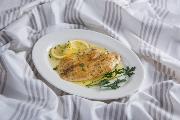 istock Pan fried tilapia  with parsley, lemon and oil (Click for more) 1276677074