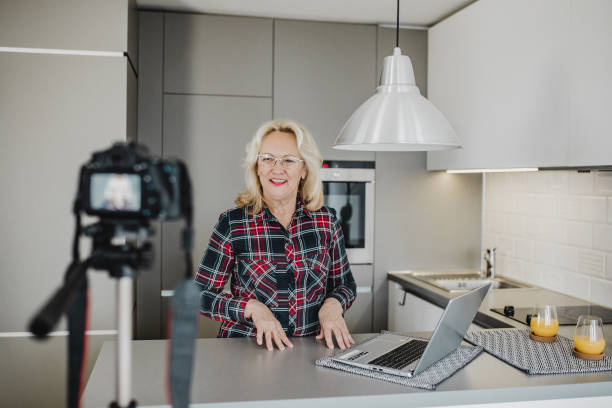 istock Senior woman vlogging 1276678338