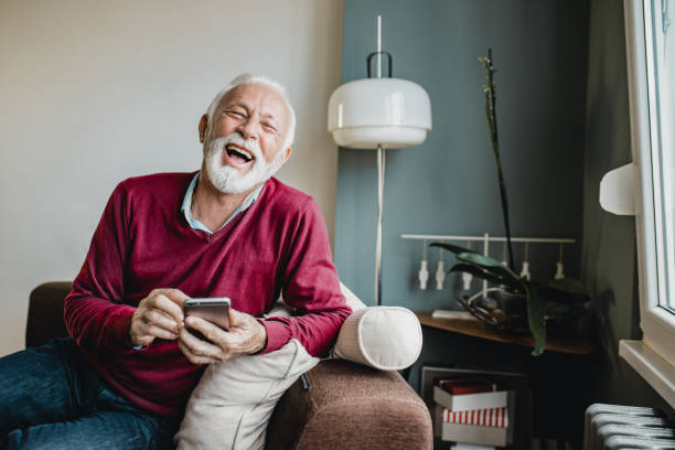 istock Senior man relaxing at home and using mobile phone 1276678485