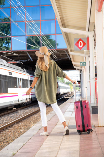 istock Unrecognizable woman waiting for train on station 1276678603