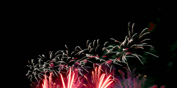 istock Red yellow fireworks, black night sky background 1276679895