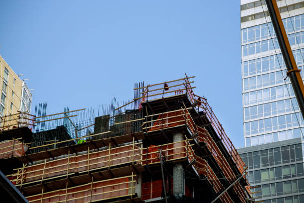 istock A construction worksite building in a big city with blue sky behind 1276680599
