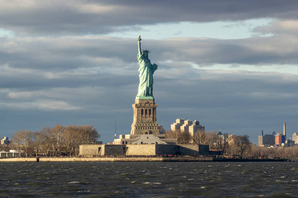 istock Statue of liberty at sunset. VIew from Staten Island Ferry 1276682193