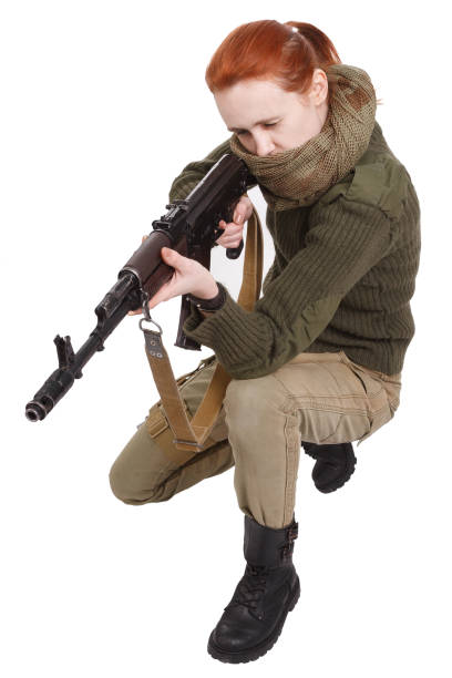 istock Girl mercenary with an assault rifle 1276682806