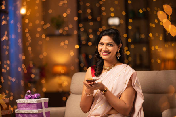 Young woman Diwali celebrate - stock photo Indian, Indian ethnicity, Indian culture, tradition, Diwali, festival human hand traditional culture india ethnic stock pictures, royalty-free photos & images