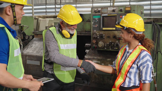 istock Group of factory workers using machine equipment in factory workshop 1276686204