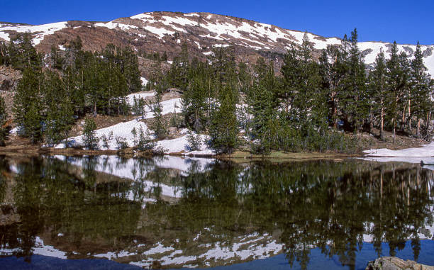 istock Sierra Nevada Lake with Clouds and Snow Patches 1276686349