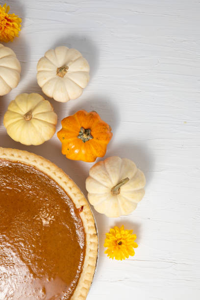 istock Pumpkin pie composition, thanksgiving, white for copy, vertical poster 1276686951