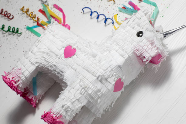 istock White and rainbow unicorn pinata, white background 1276687004