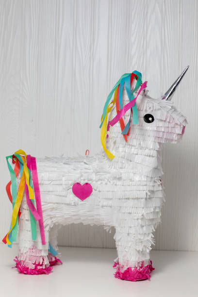 istock White and rainbow unicorn pi-ata, white background 1276687120