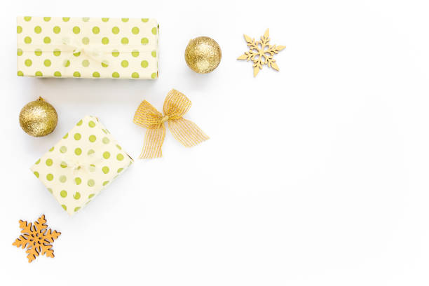 istock Christmas Texture made of gold decorations on white background with empty copy space for text. Holiday and celebration concept. Top view. Flat lay 1276687206