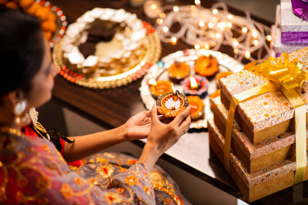 Young woman diwali celebrate - stock photo India, Indian Ethnicity, Indian Culture, Tradition, Festival, Diwali, india sweets stock pictures, royalty-free photos & images