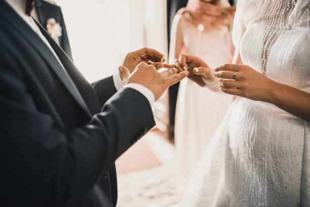 istock The bride and groom puts a wedding ring 1276690382