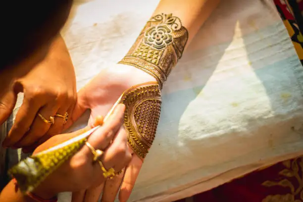 Photo of mehndi designs of hand of a groom