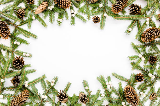 istock Frame made of Christmas composition with fir branches, pine cones on white background. Flat lay, top view holiday decoration concept 1276691534