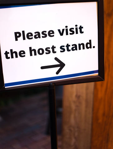 Restaurant Sign: Please Visit the Host Stand