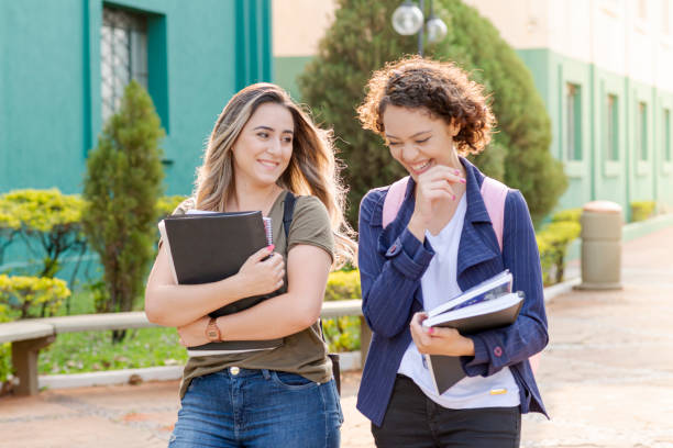 istock High school friends laughing when leaving school activities 1276694116