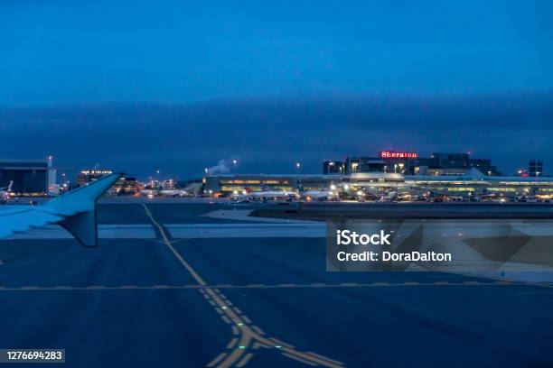 Neon Sign Of Sheraton Hotel At The Terminal Of Pearson International Airport At Dusk Toronto Canada Stock Photo - Download Image Now