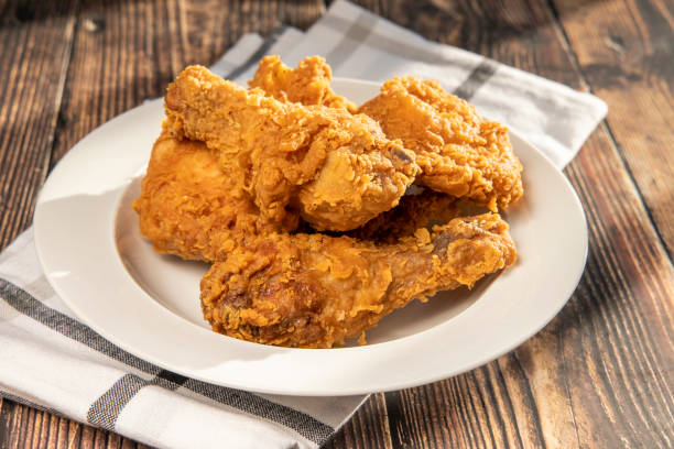 Fried Chicken crispy kentucky fried chicken in a wooden table fried chicken stock pictures, royalty-free photos & images