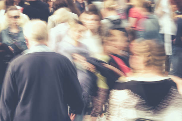 istock Blurred busy city traffic from people in summer 1276702420